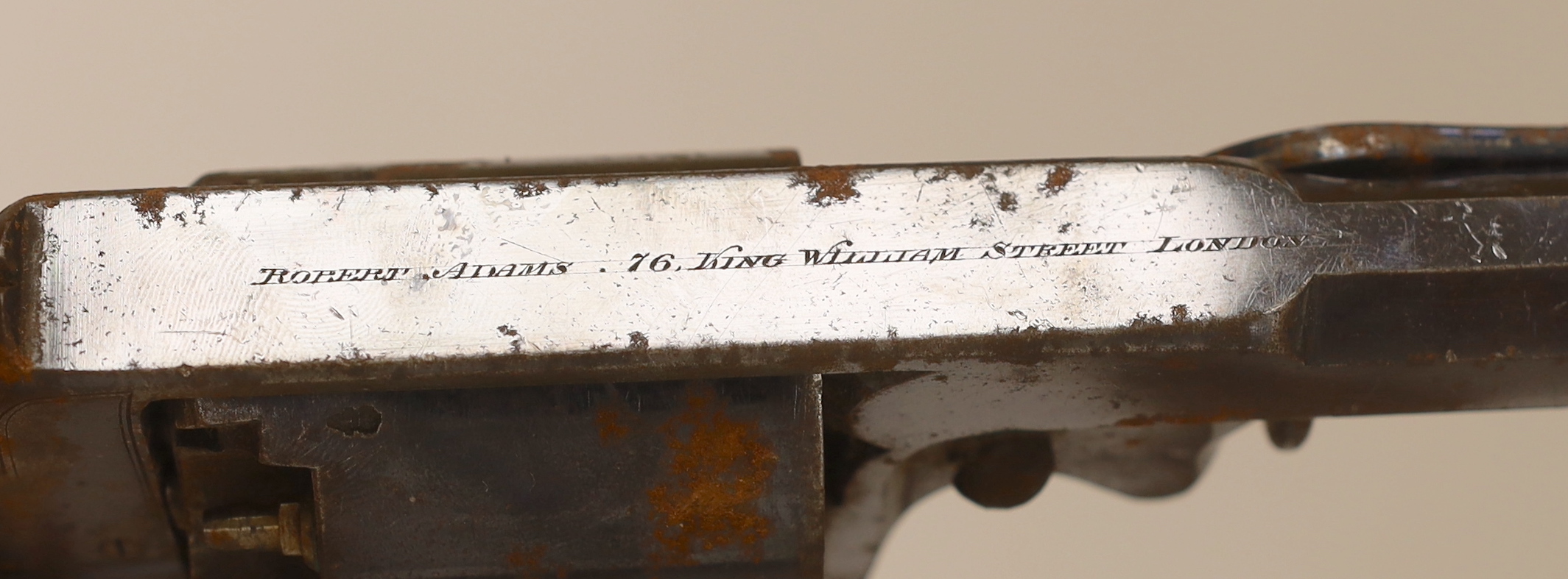 A five shot 38 bore Beaumont Adams patent double action percussion Dragoon pistol, retaining much of its original blued finish, top strap engraved Robert Adams 76 King William Street London